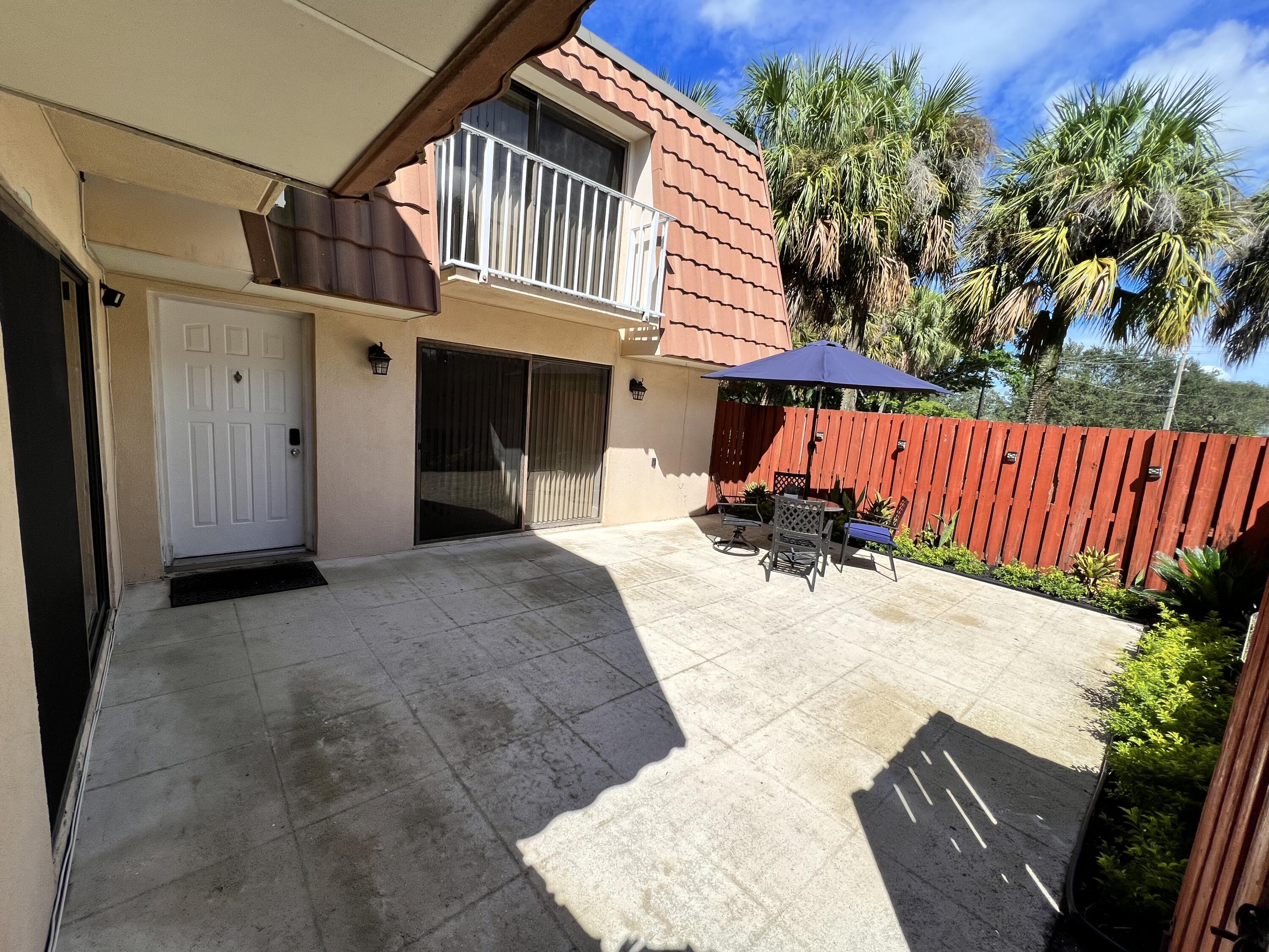 802 Blue Ridge Circle West Palm Beach, FL 33409 - Photo 8 of 37 a view of a house with a patio