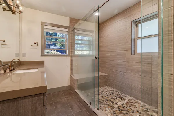 a bathroom with a sink and a shower