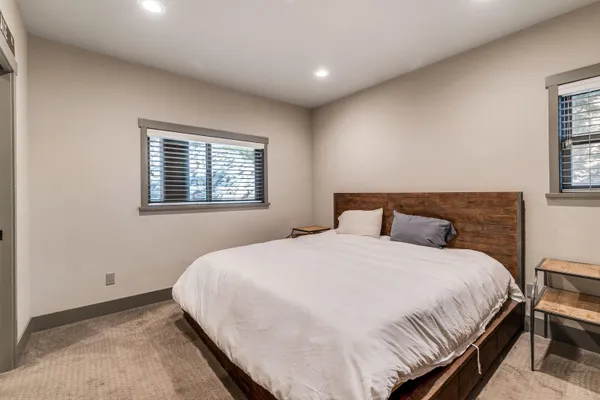 a bedroom with a bed and a television