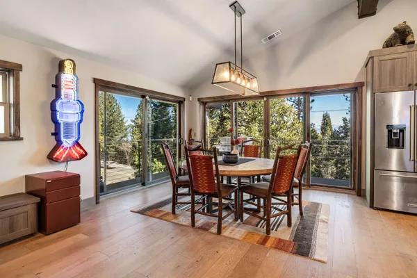 a view of a dining room with furniture window and wooden floor