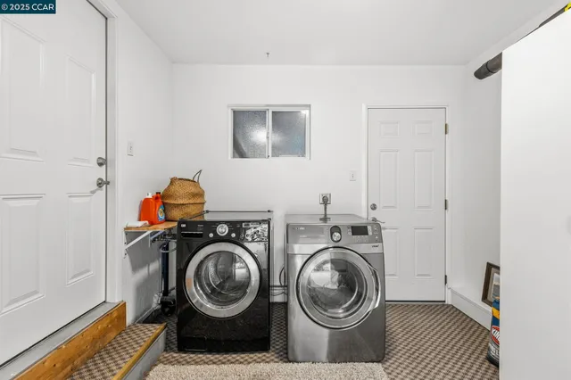 a view of washer and dryer in a utility room