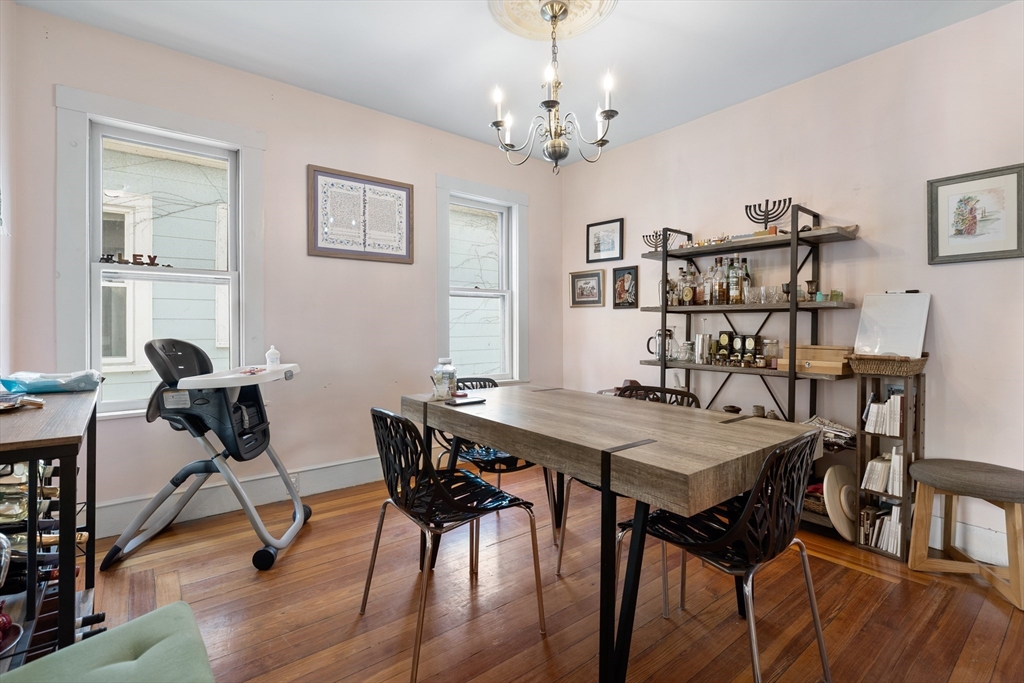 14-16 Holyoke Road Somerville, MA 02144 - Photo 15 of 34 a view of a dining room with furniture and wooden floor