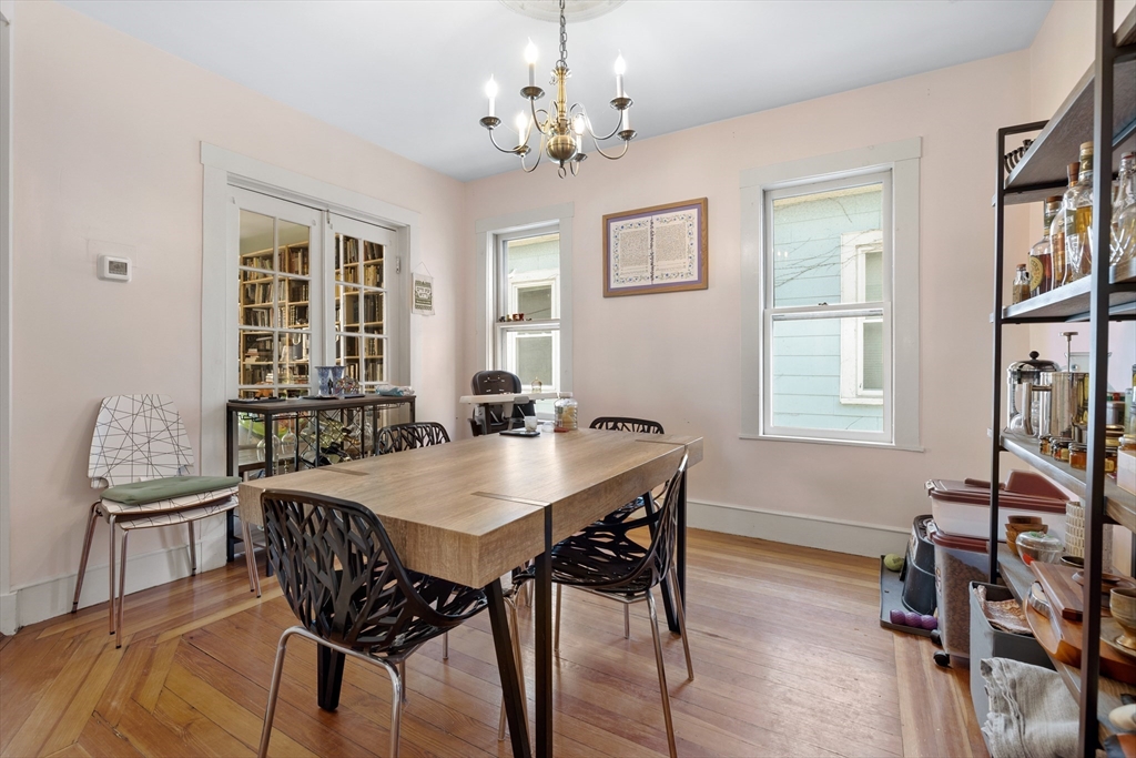 14-16 Holyoke Road Somerville, MA 02144 - Photo 16 of 34 a view of a dining room with furniture and a chandelier