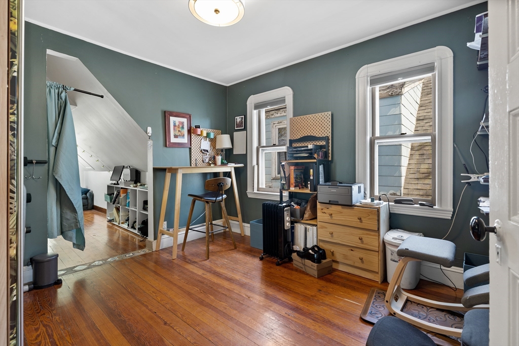 14-16 Holyoke Road Somerville, MA 02144 - Photo 19 of 34 a view of a livingroom with workspace and a window
