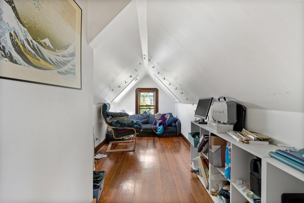 14-16 Holyoke Road Somerville, MA 02144 - Photo 20 of 34 a living room with furniture and a wooden floor