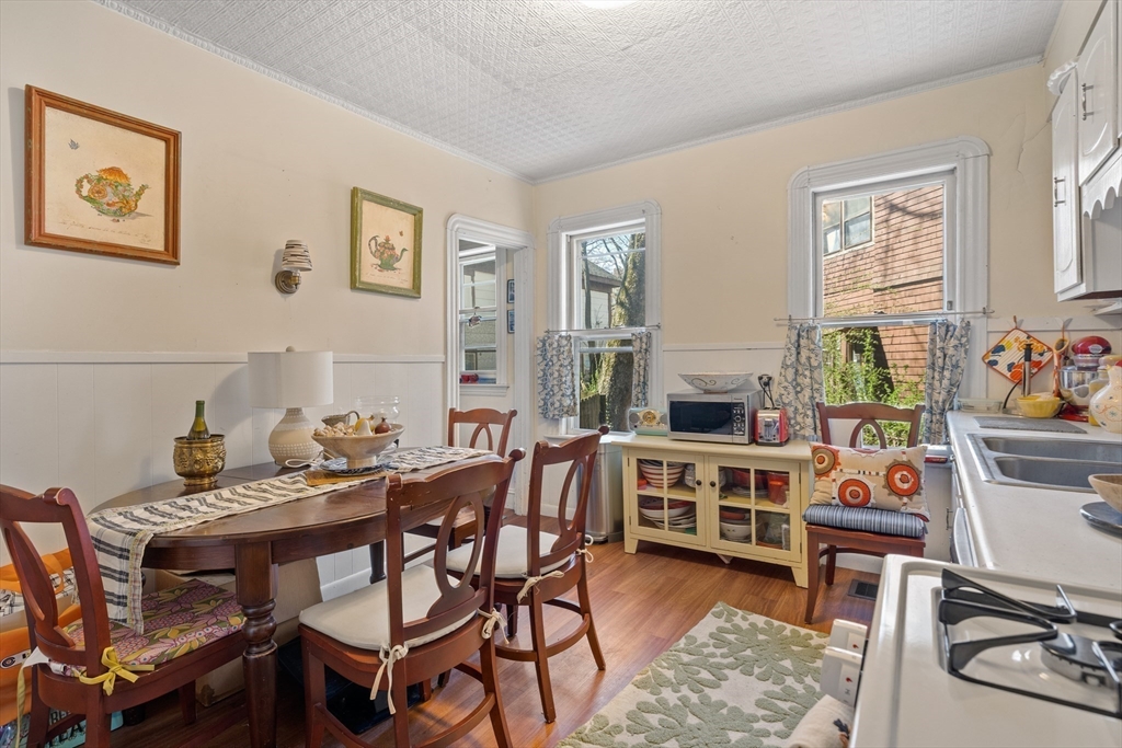 14-16 Holyoke Road Somerville, MA 02144 - Photo 22 of 34 a view of a dining room with furniture a rug and wooden floor