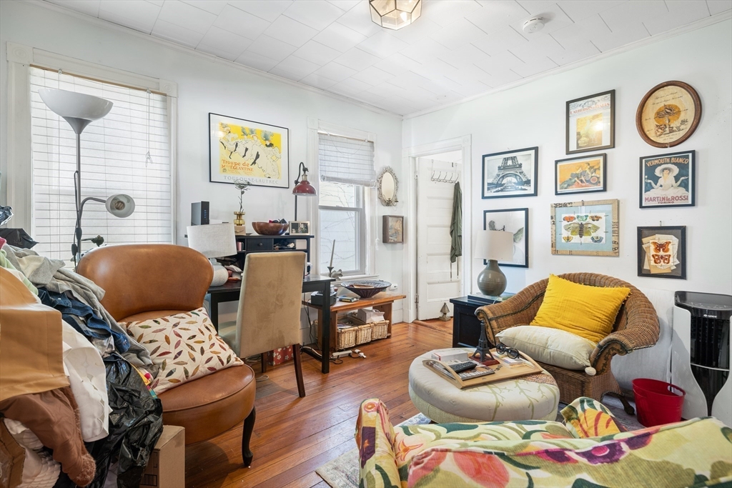 14-16 Holyoke Road Somerville, MA 02144 - Photo 27 of 34 a living room with furniture and wooden floor