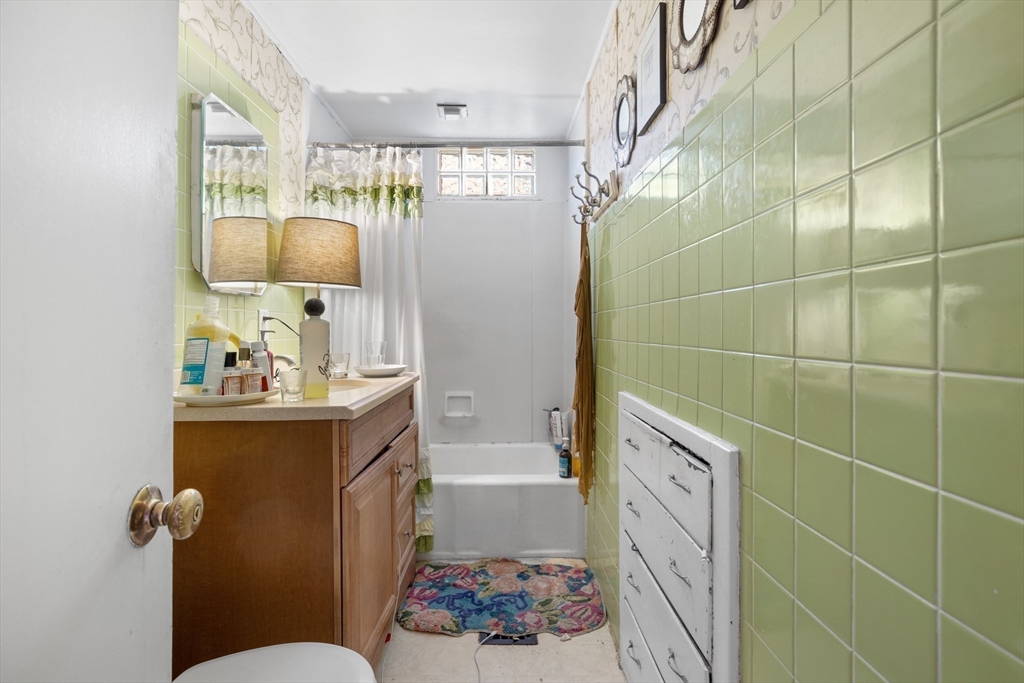 14-16 Holyoke Road Somerville, MA 02144 - Photo 28 of 34 a bathroom with a sink toilet and shower