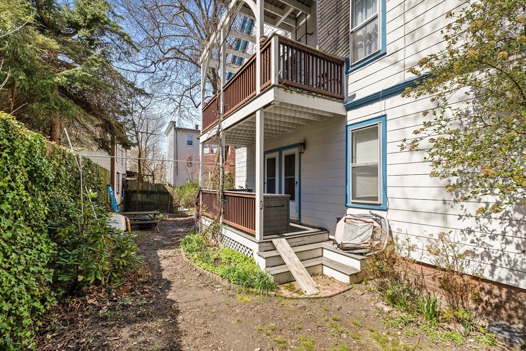 14-16 Holyoke Road Somerville, MA 02144 - Photo 31 of 34 a view of a chair and tables in the patio