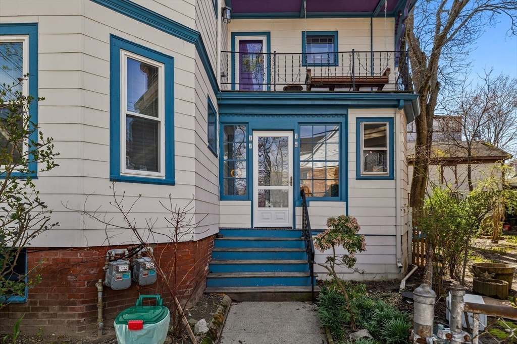 14-16 Holyoke Road Somerville, MA 02144 - Photo 32 of 34 a front view of a house with a yard
