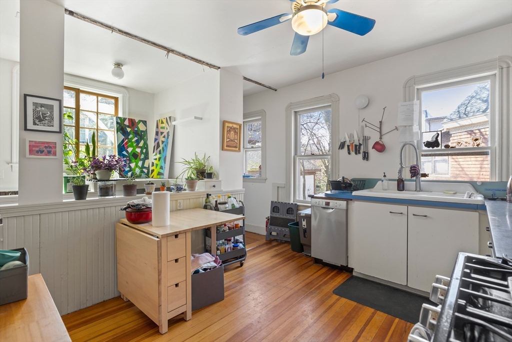 14-16 Holyoke Road Somerville, MA 02144 - Photo 5 of 34 a kitchen that has a lot of cabinets in it