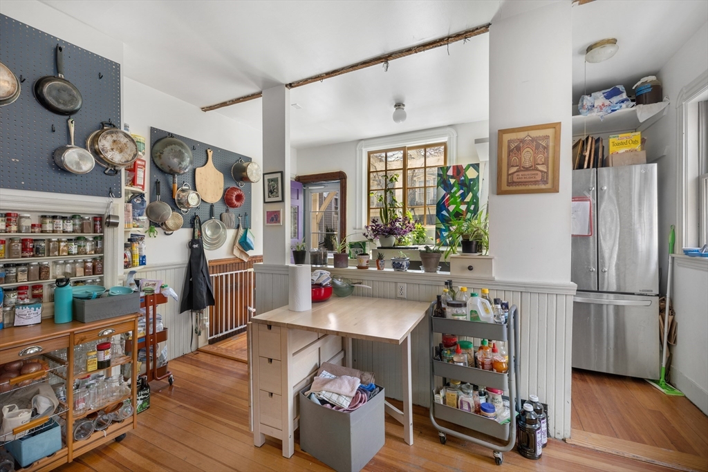 14-16 Holyoke Road Somerville, MA 02144 - Photo 6 of 34 a view of a play room with toys and wooden floor