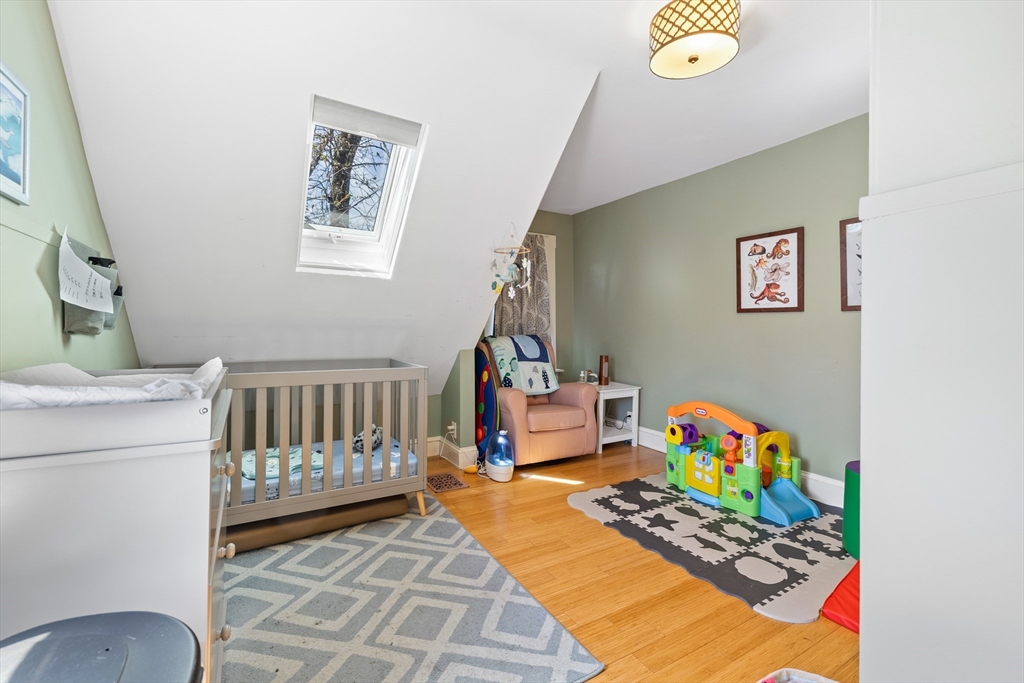 14-16 Holyoke Road Somerville, MA 02144 - Photo 8 of 34 a bedroom with furniture and a couch