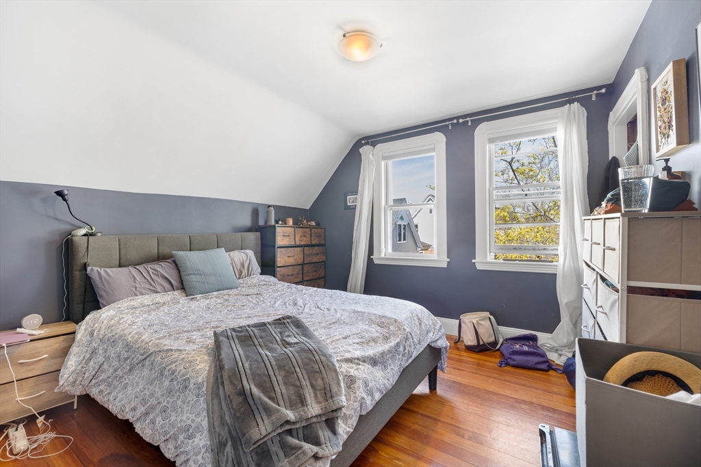 14-16 Holyoke Road Somerville, MA 02144 - Photo 10 of 34 a bedroom with a bed and a window