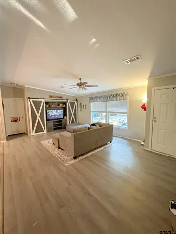 a living room with furniture and a table