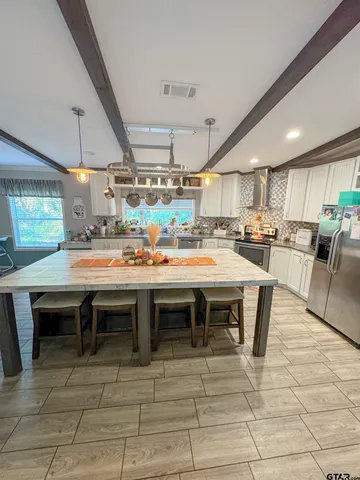 a open kitchen with a table and chairs