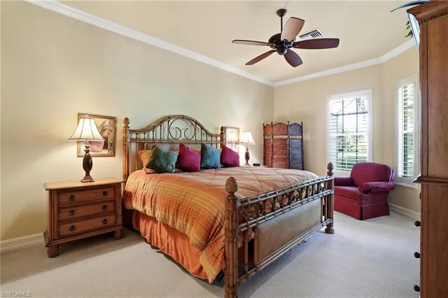 a bed room with a bed and a chandelier