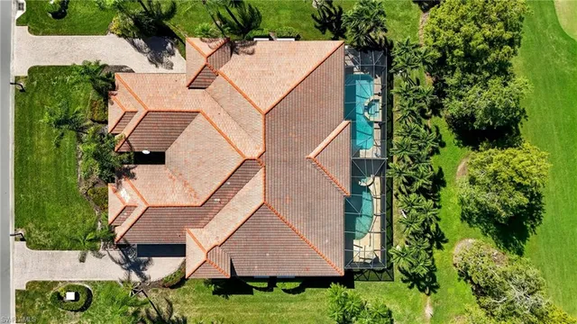 a view of a garden with a house