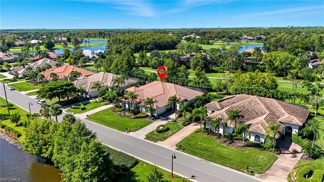 an aerial view of residential houses with outdoor space and street view