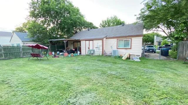 a view of a house with backyard porch and sitting area