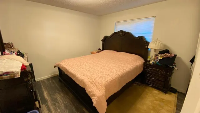 a bedroom with a bed and a closet