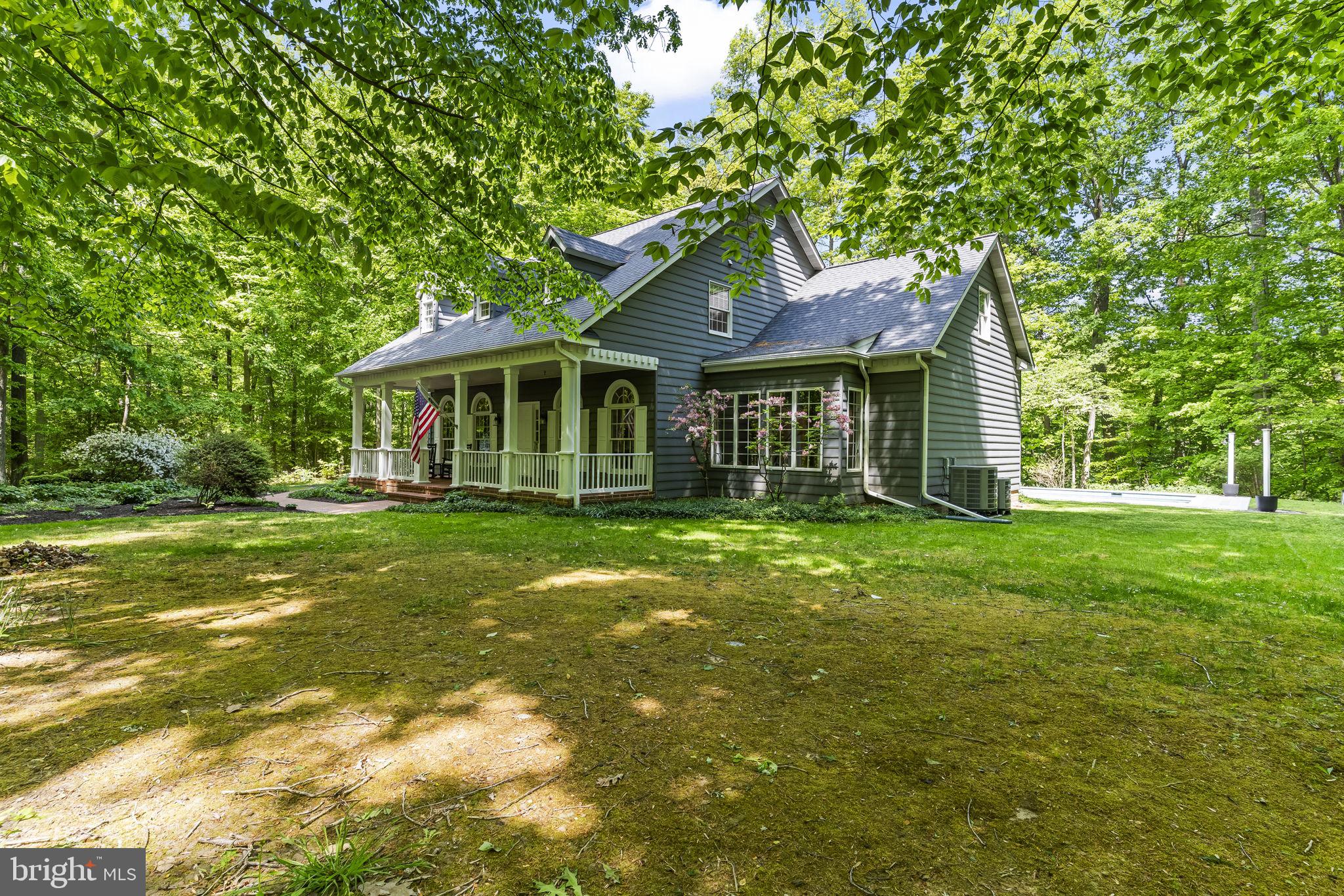 4111 Buck Board Lane Dunkirk, MD 20754 - Photo 11 of 74 a front view of a house with a garden