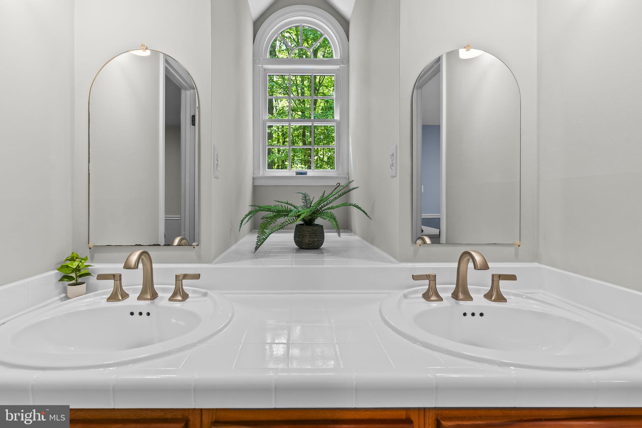 4111 Buck Board Lane Dunkirk, MD 20754 - Photo 37 of 74 a bathroom with mirror and window
