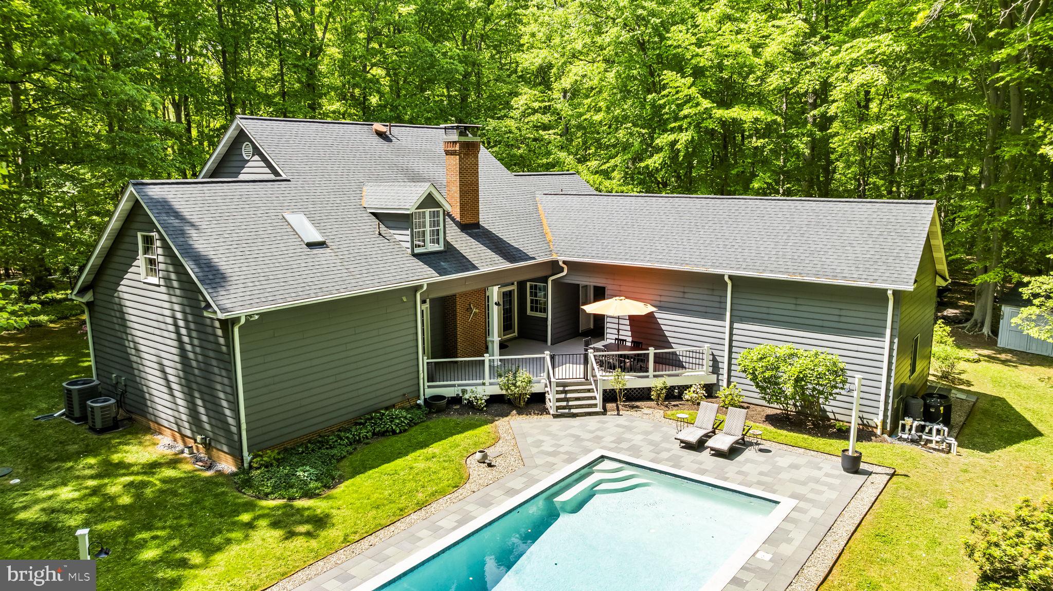 4111 Buck Board Lane Dunkirk, MD 20754 - Photo 52 of 74 aerial view of a house with swimming pool and sitting area