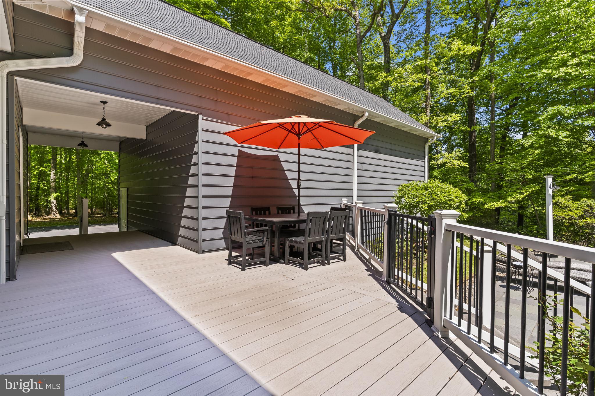 4111 Buck Board Lane Dunkirk, MD 20754 - Photo 53 of 74 a view of backyard with a deck and furniture