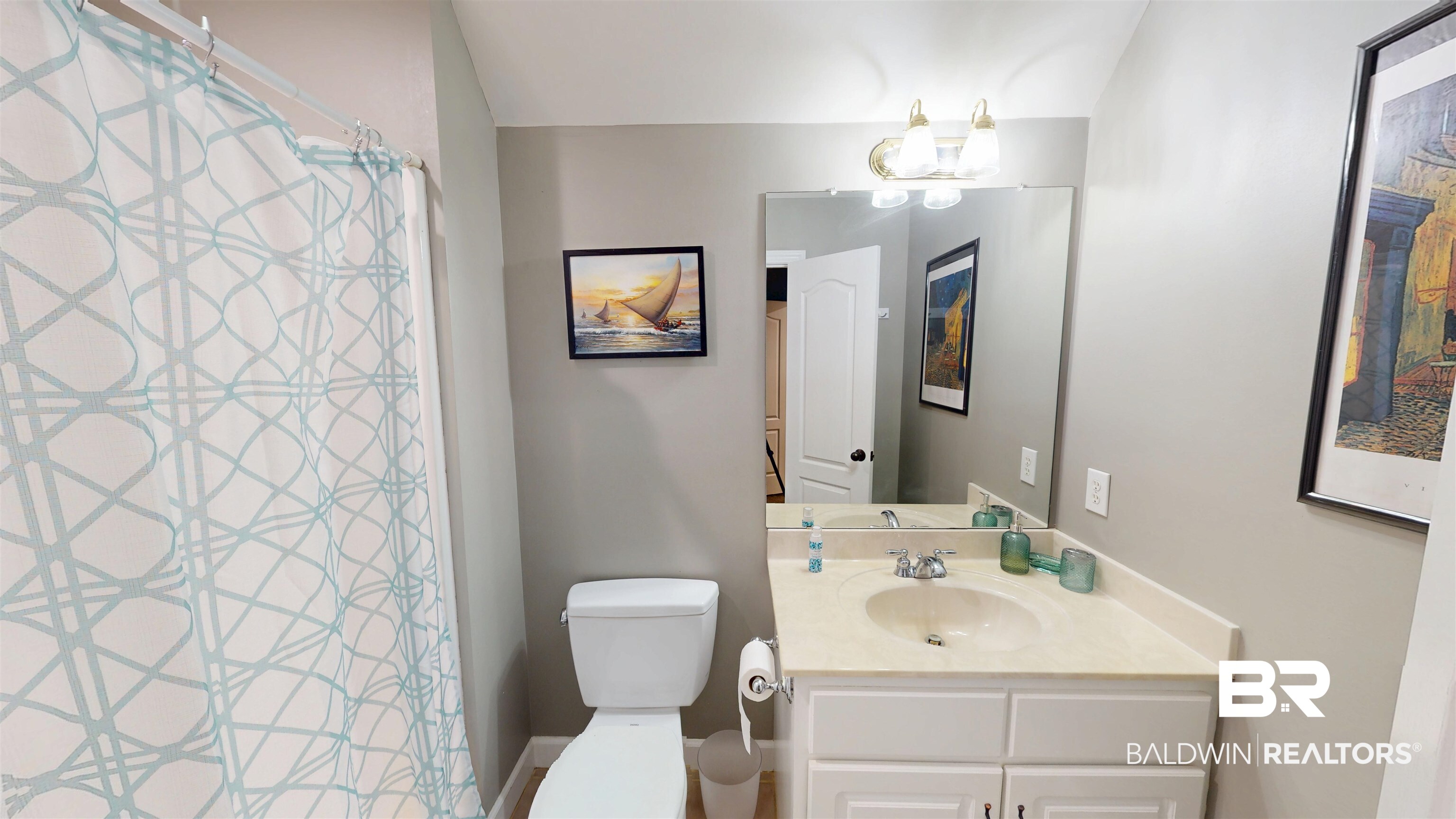 8775 Dawes Lake Road North Mobile, AL 36619 - Photo 38 of 59 Full bath featuring vanity, a chandelier, and a shower with curtain