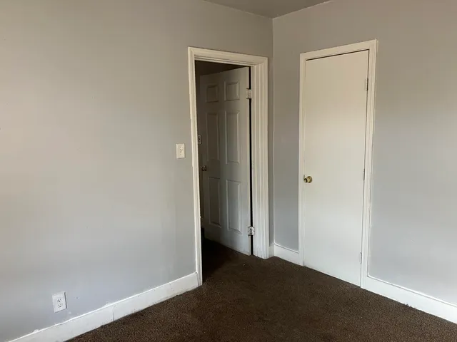 a bathroom with a sink toilet and a mirror