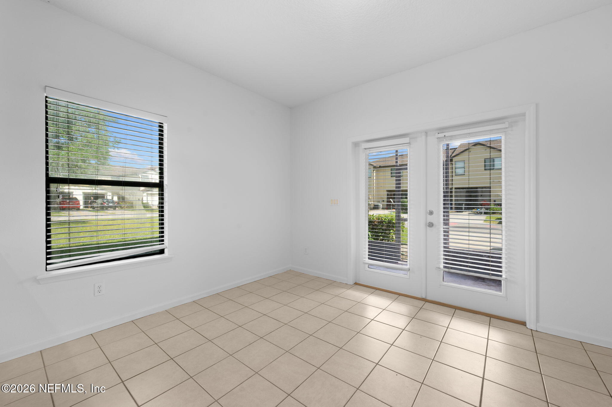 253 Syrah Way St. Augustine, FL 32084 - Photo 13 of 39 a view of an empty room with window and cabinet