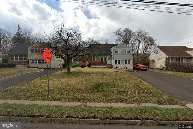635 West County Line Road Hatboro, PA 19040 - Photo 4 of 10 a front view of a residential apartment building with a yard