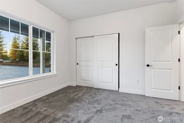 a spacious bathroom with a tub sink and mirror
