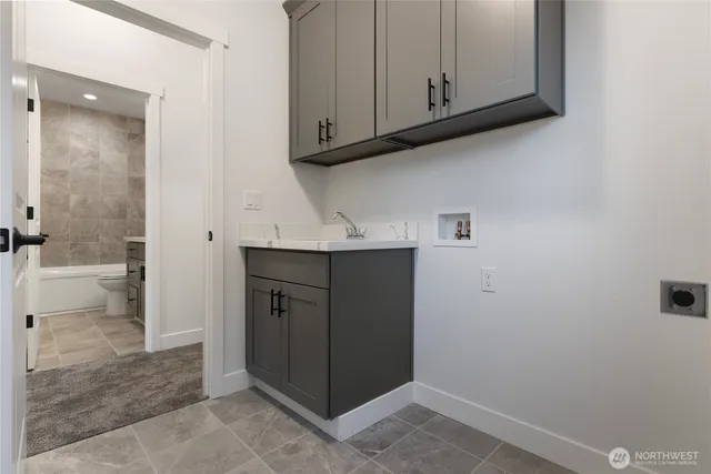 a bathroom with a tub sink and shower
