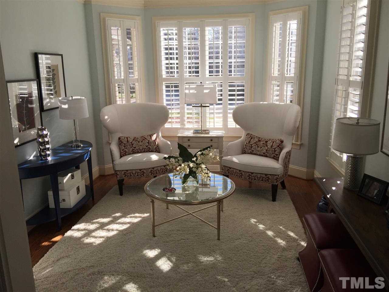 1832 Torrington Street Raleigh, NC 27615 - Photo 2 of 6 a living room with furniture and a large window