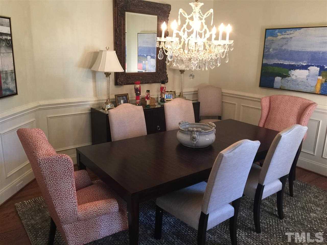 1832 Torrington Street Raleigh, NC 27615 - Photo 3 of 6 a view of a dining room with furniture and chandelier