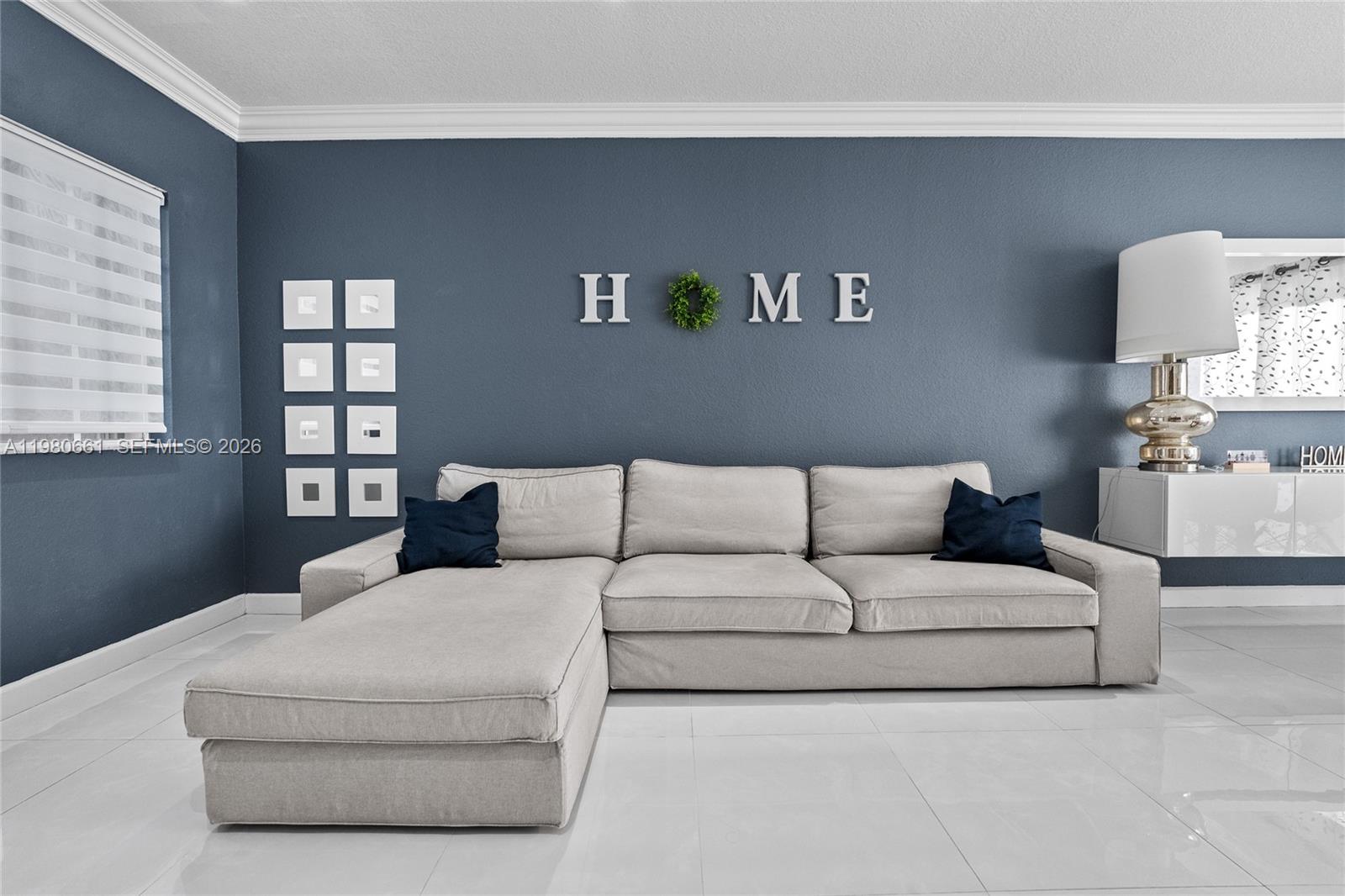 a living room with furniture and a night stand