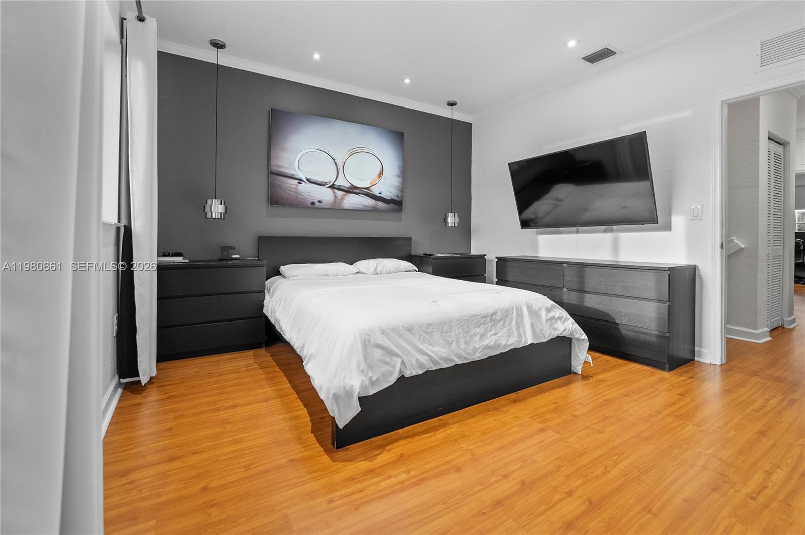 21474 Southwest 85th Path Cutler Bay, FL 33189 - Photo 17 of 30 a bedroom with a bed and a flat screen tv