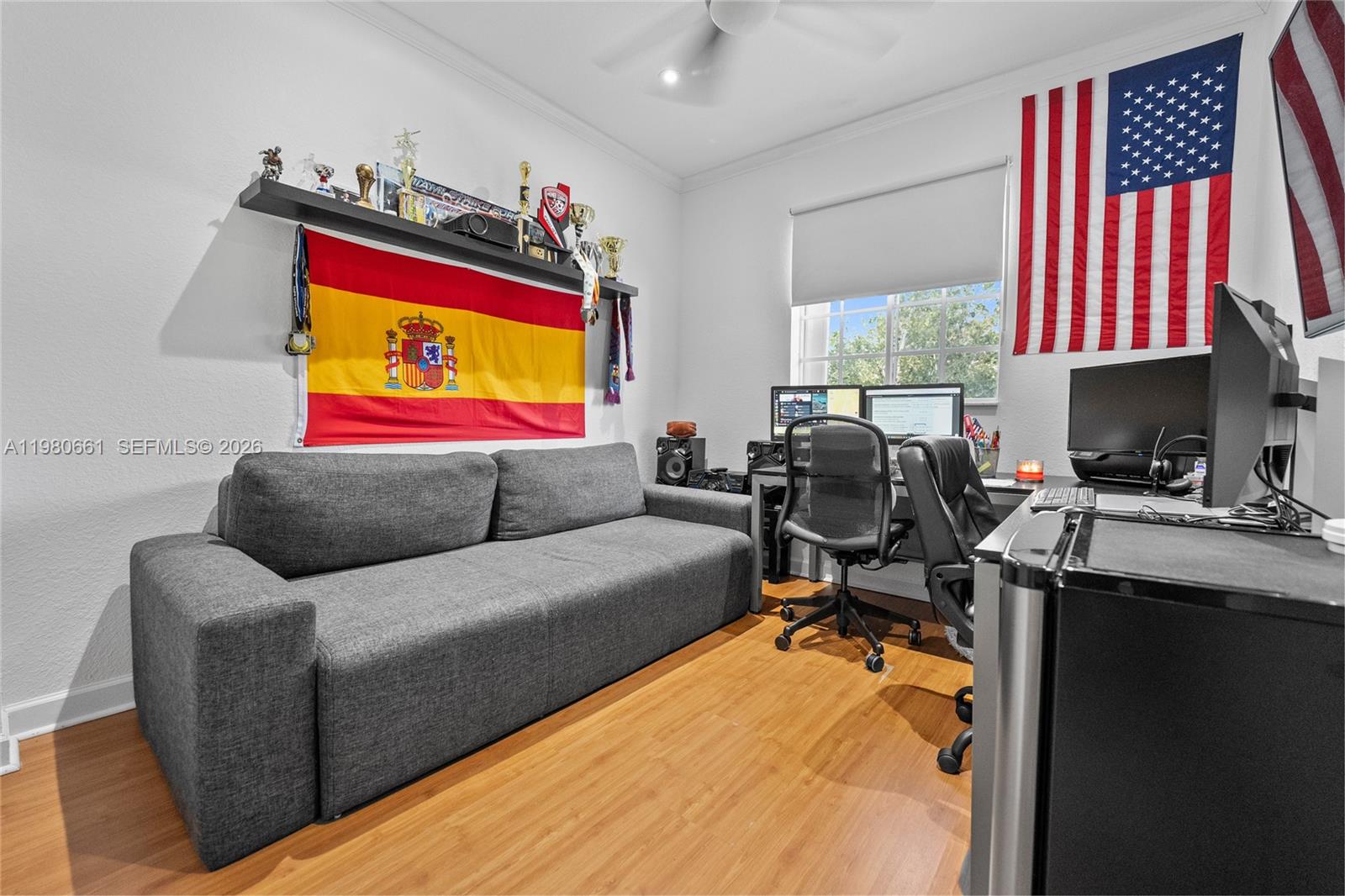 21474 Southwest 85th Path Cutler Bay, FL 33189 - Photo 25 of 30 a living room with furniture projector and a workspace