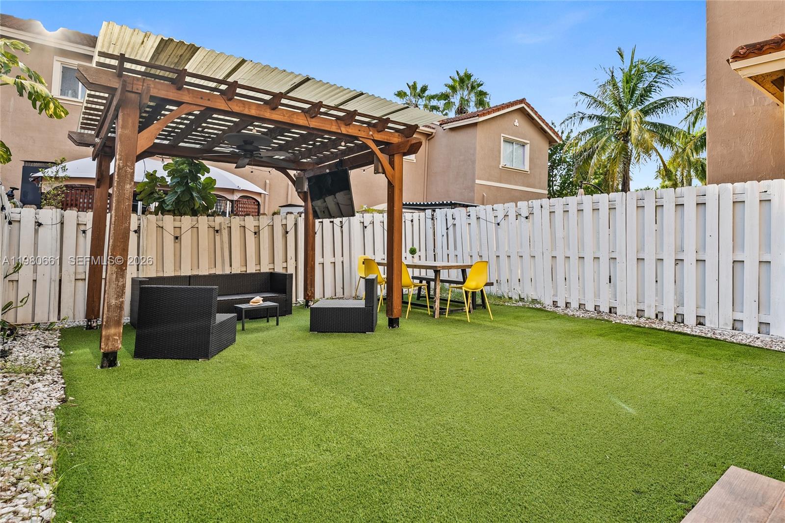 21474 Southwest 85th Path Cutler Bay, FL 33189 - Photo 26 of 30 a view of a house with backyard and porch