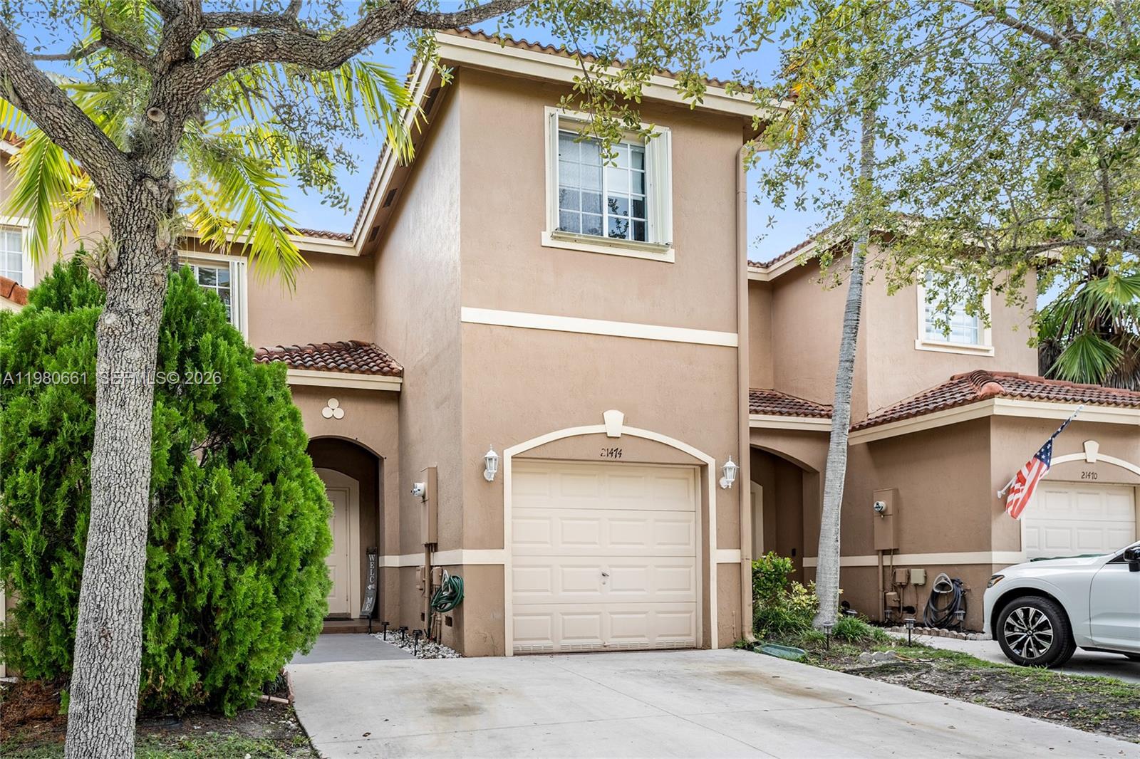 21474 Southwest 85th Path Cutler Bay, FL 33189 - Photo 3 of 30 a car parked in front of a white house
