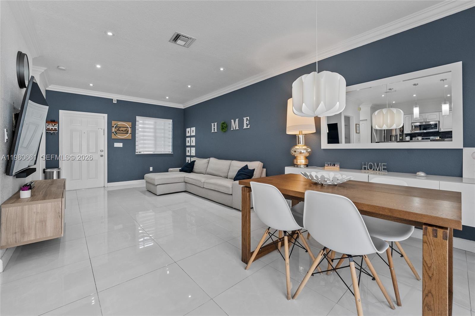 21474 Southwest 85th Path Cutler Bay, FL 33189 - Photo 7 of 30 a living room with furniture and a flat screen tv