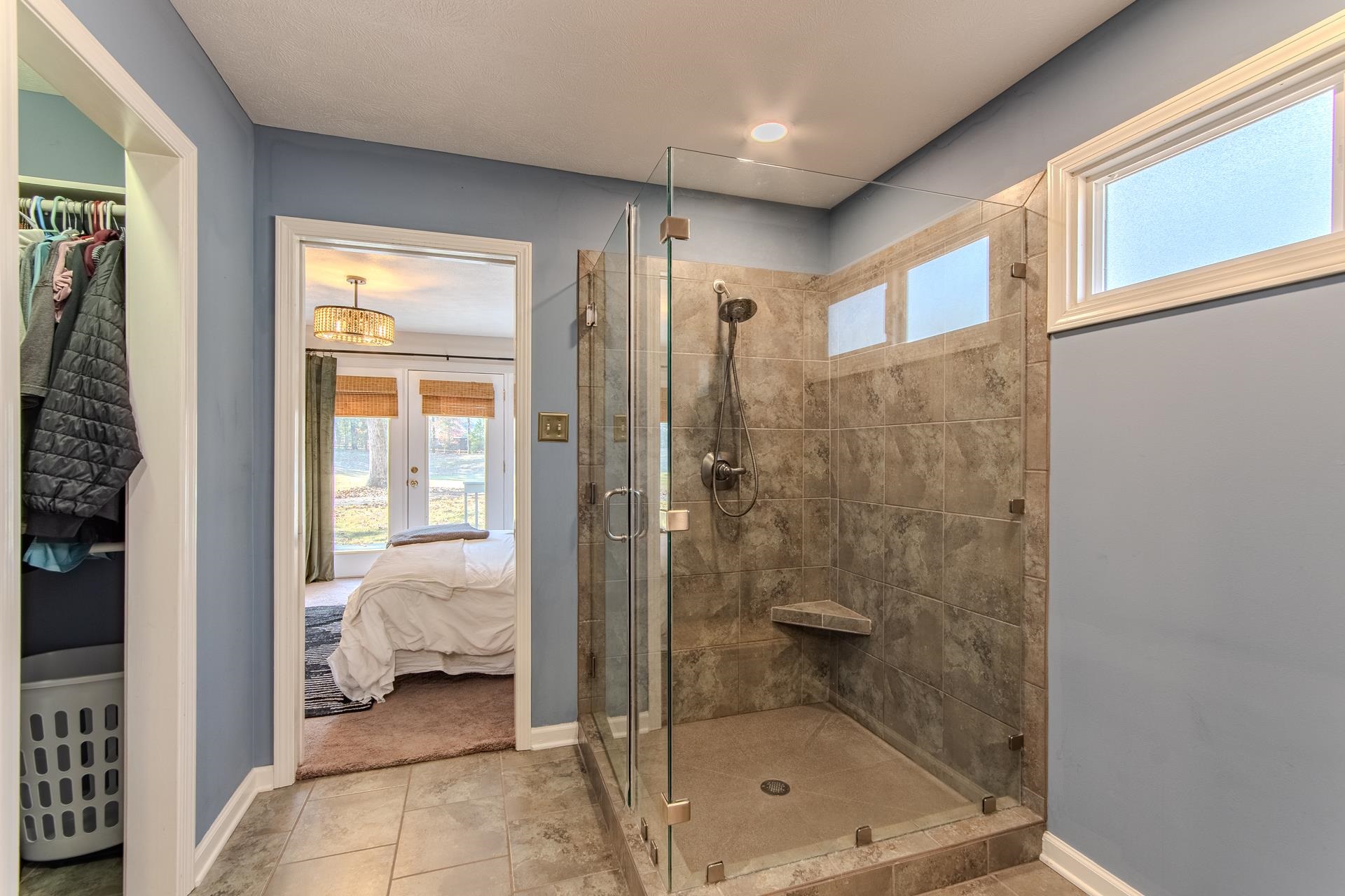 215 St Andrew's Court Counce, TN 38326 - Photo 14 of 37 a bathroom with a tub and shower