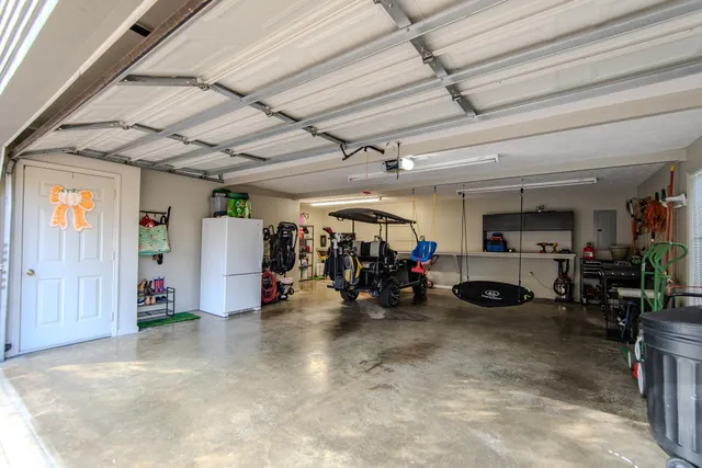 a view of a garage with a bike and car