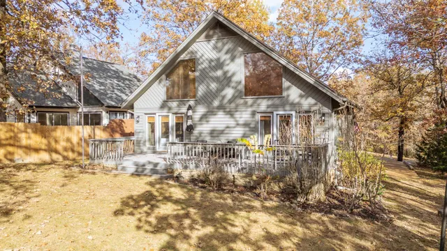 a view of residential houses with trees