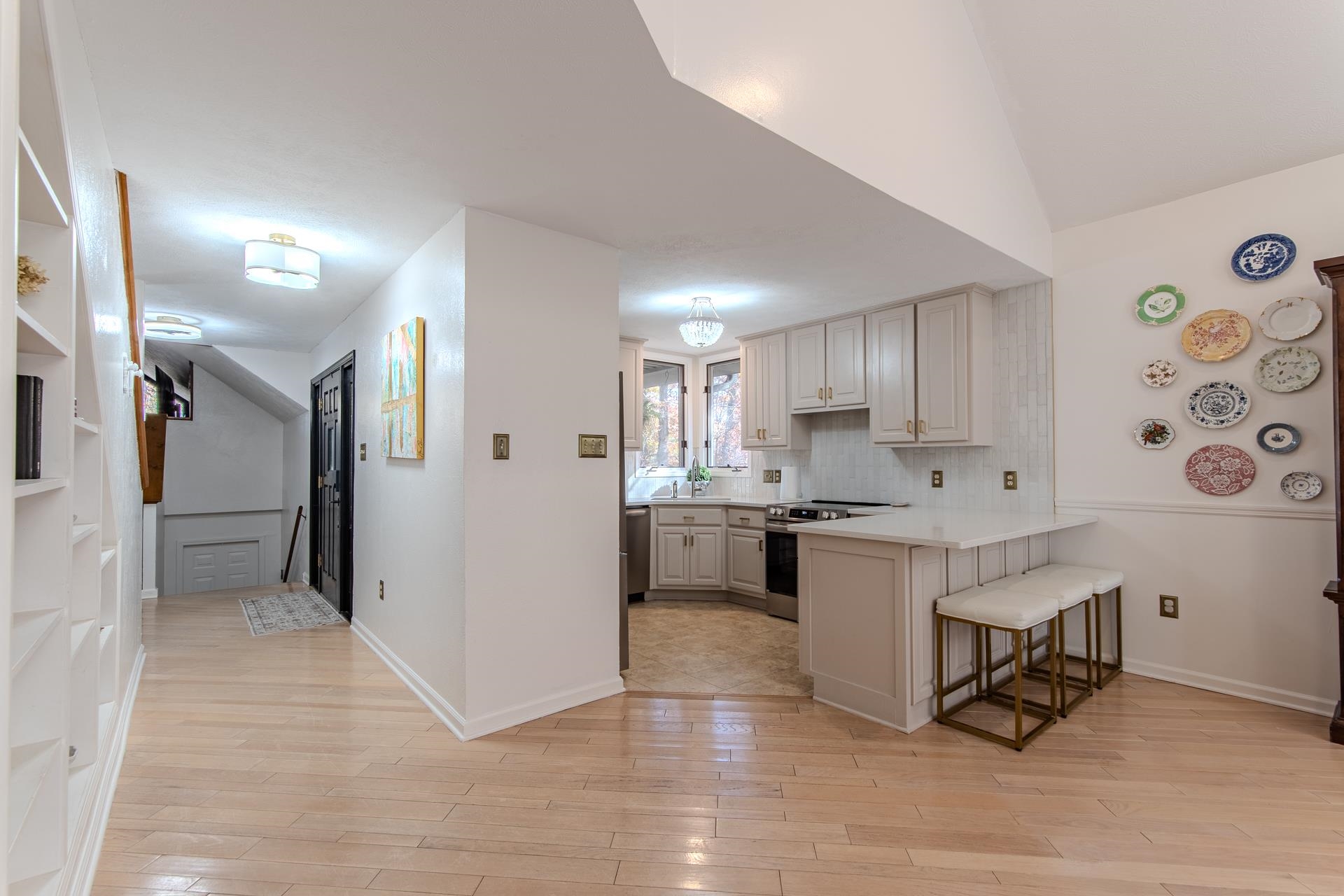 215 St Andrew's Court Counce, TN 38326 - Photo 7 of 37 a kitchen with granite countertop a refrigerator and white cabinets