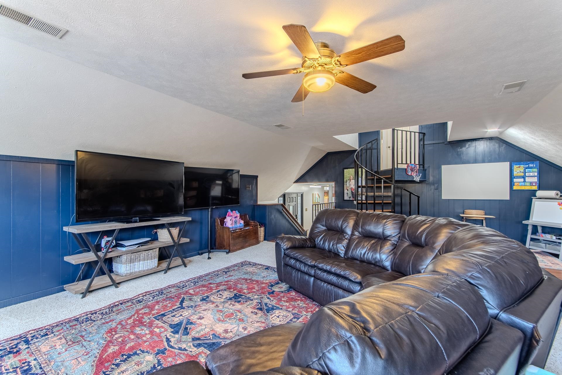 215 St Andrew's Court Counce, TN 38326 - Photo 10 of 37 a living room with furniture and a flat screen tv