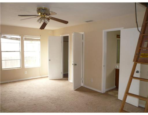 4013 Cott Street Corpus Christi, TX 78411 - Photo 5 of 7 a view of empty room with wooden floor and fan