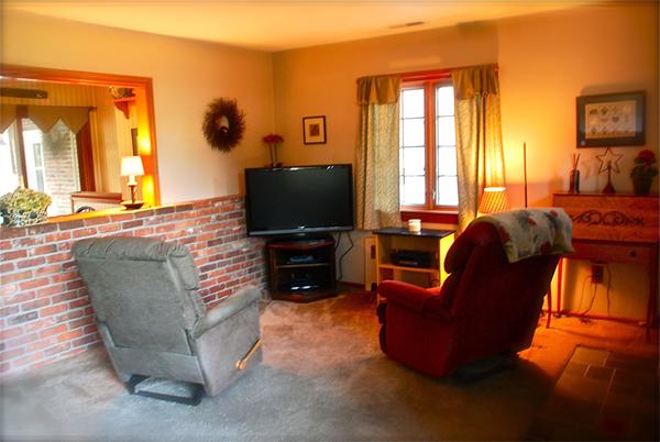 239 Ryan Road Northampton, MA 01062 - Photo 2 of 18 a living room with furniture a flat screen tv and a window